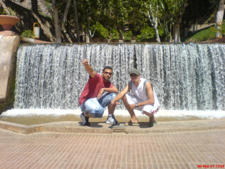 under the sun,the watter-fall is behind!